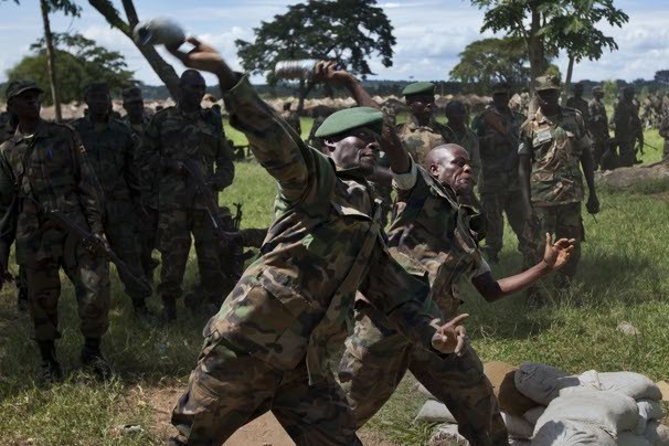 n an effort to combat al-Qaeda militants in Somalia, the United States has been training troops from other African nations to be peacekeepers.  1/10 Share ThumbsAutoplay 5 Seconds 00:0000:00 1 2 3 4 5 6 7 8 9 10  April 30, 2012  Soldiers from the Uganda People's Defence Force throw plastic bottles filled with sand as they simulate grenade throwing at the Singo training facility in Kakola, Uganda. Ben Curtis / AP Related Content